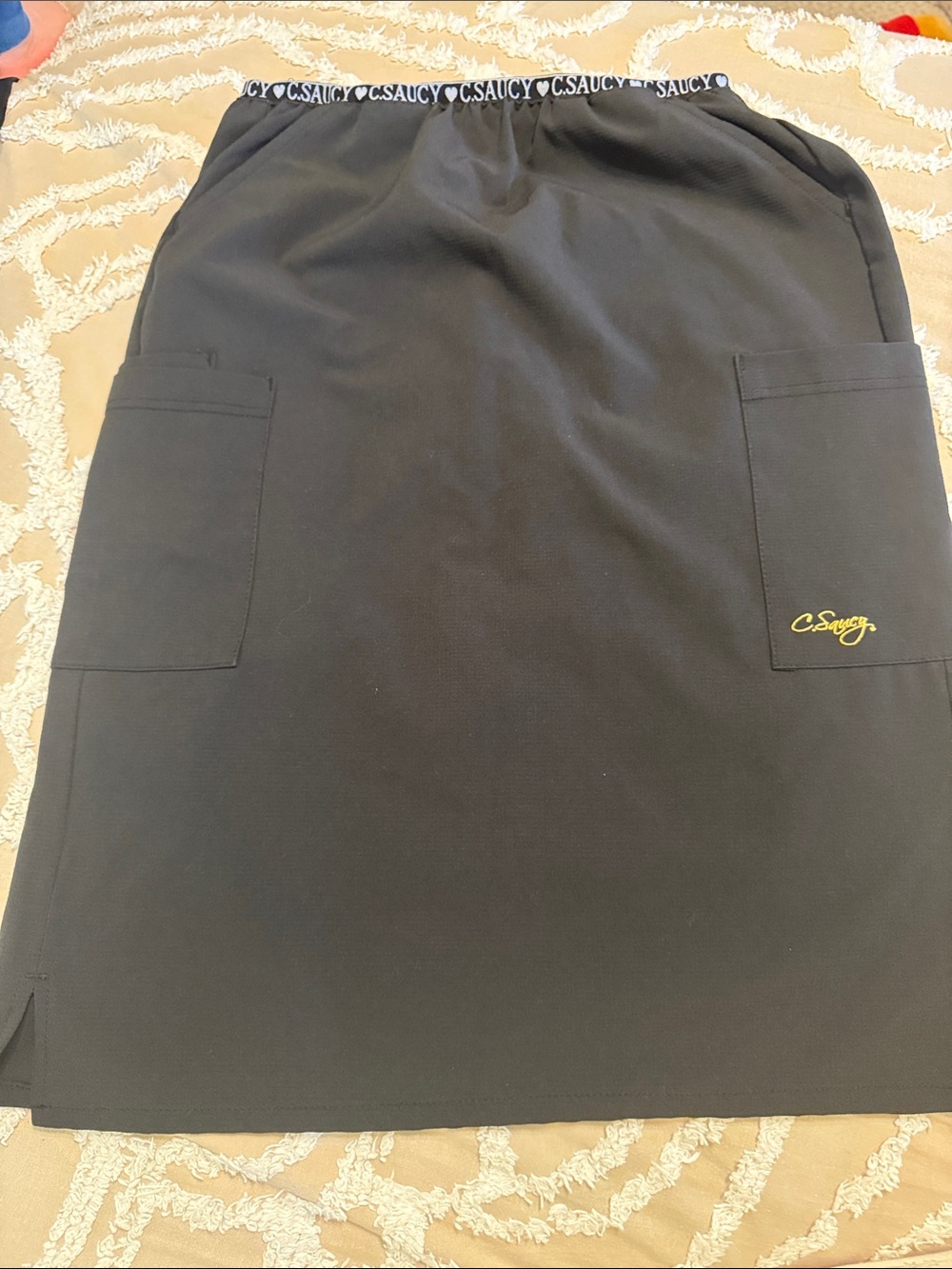 C. Saucy Black scrub skirt. Size small long.
